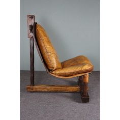 a chair made out of wood and leather