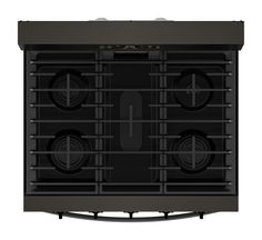 a black stove top with four burners on the front and two oven doors open