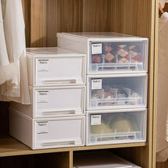 the closet is filled with plastic containers and drawers