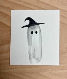 a drawing of a tooth with a witches hat on it