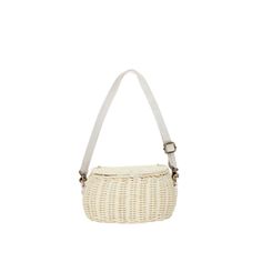 the small white basket bag is shown with straps on one side and an adjustable strap at the