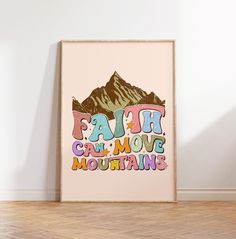 a poster with the words faith can move mountains on it in front of a white wall