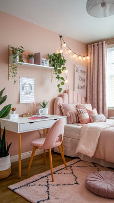 a bedroom decorated in pink and gold with plants on the wall, bedding, rugs, pillows, and other decorations