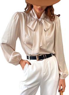 Look sophisticated and stylish in this Champagne Gold Satin Bow Tied Long Sleeve Top Blouse. Crafted with a luxe satin fabric giving it a smooth feeling and a bow tied at the front, this top is sure to be the perfect addition to any wardrobe. Materials: 97% Polyester, 3% Spandex Imported Drawstring closure Machine Wash XS = Dress 0-2, Bust, 31"-32.5", Waist 23"-24, Hip 31"- 34"Small = Dress 4-6, Bust,33"-35", Waist 25-26", Hips 35"-37"Medium = Dress 8-10, Bust 35-36" Waist 27-28", Hips 38-39"Large =Dress 12-14,Bust,38-40, Waist,29-31", Hips 40-42"14/16 - Bust 40"-42", Waist 33.5"-36", Hips 44"-46"18/20 - Bust 42"-44", Waist 37"- 40", Hips 47"-50"22/24 - Bust 44"-46", Waist 41"-46", Hips 51"-55"26/28 - Bust 46"-48", Waist 47"-50", Hips 56-60" Bow Tie Blouse, Fearless Women, Gold Satin, Medium Dress, Large Dress, Satin Shirt, Satin Blouse, Satin Bow, Small Dress