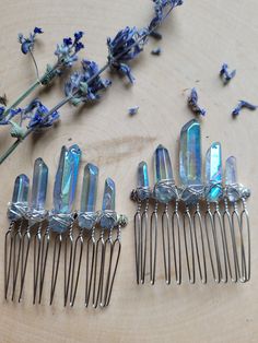 "This blue aura quartz hair comb features five iridescent blue-gray aura quartz crystals measuring between 1/2\" - 1\" tall wire wrapped securely on a 2\" wide silver hair comb.  This boho crystal hairpin is perfect for weddings, photoshoots, dress up, festivals, or any time you want to add a bit of magic to your look. This Crystal Hair clip slides into the hair comfortably Blue aura quartz crystal helps you connect to your higher spirituality, speak your truth, and channel positive cosmic energy of serenity and joy.  Don't see a color, style, or size you like? Message me, and I will customize a piece to fit your exact taste! Please like my page on Facebook: https://www.facebook.com/HempClub I created this shop in memory of my best friend Julie Elizabeth Berls, who passed away December 31s Gray Aura, Blue Aura Quartz, Galaxy Wedding, Crystal Hair Clip, Speak Your Truth, Silver Hair Comb, Aura Quartz Crystal, Blue Aura, Crystal Hair Accessories