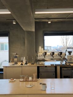 a coffee machine sitting on top of a counter in a kitchen