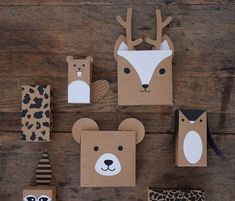 some paper animals and other items on a wooden table