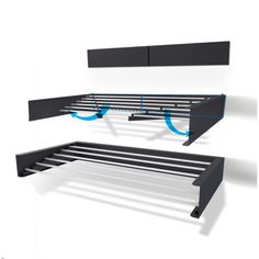 a black shelf with two blue circles hanging from it's sides and another shelf on the other side