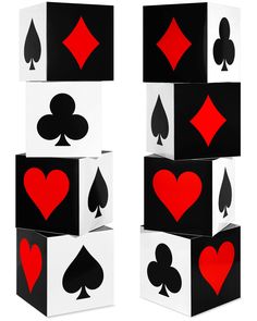 four playing cards stacked on top of each other with hearts, spades and diamonds