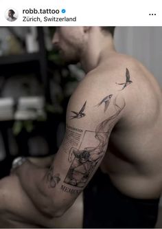 a man with a tattoo on his arm is looking down at the ground and has birds flying above him