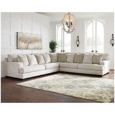 a living room with a sectional couch and rug