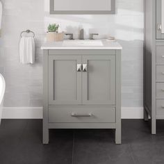 a bathroom with a sink, mirror and bathtub in the background is white tile