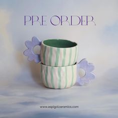 two striped cups with flowers on them sitting next to the words pre order written in purple and green