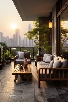 a balcony with two couches and tables on the floor next to each other in front of a cityscape