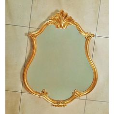 a mirror sitting on top of a tiled floor