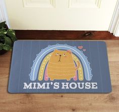 a door mat that says mimi's house with a cat in the center and rainbow on it