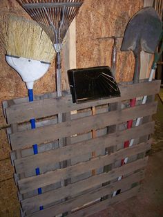 there are two brooms on top of a pallet