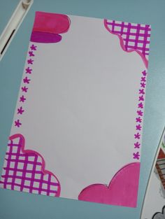 a piece of paper with pink and purple designs on it