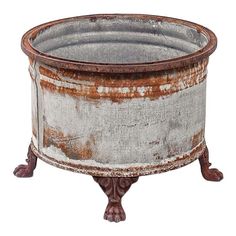 an old metal planter is shown on a white background