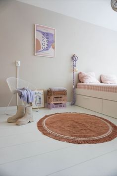 a bedroom with white floors and pink walls