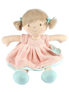 a small stuffed doll with a pink dress and blue shoes on it's feet