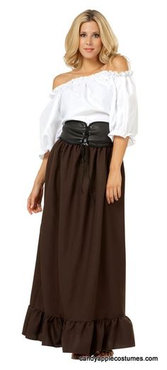 a woman wearing a long brown skirt and white shirt with black belted waist, standing in front of a white background