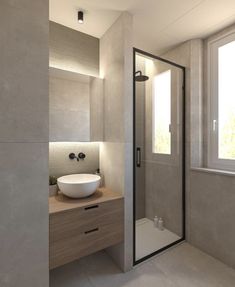 a bathroom with a sink, mirror and shower stall in front of a large window