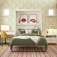 a bedroom with green and red wallpaper, white bedding and two pictures on the wall