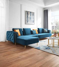 a living room scene with focus on the blue couch