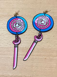 From the show steven universe, rose's sword and shield earrings Steven Universe Earrings, Adjustable Pink Jewelry For Cosplay, Galaxy Earrings, Cat Earrings, Girls Prints, Etsy Earrings Dangle, Clay Projects, Steven Universe, Jewelry Earrings Studs