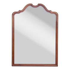 a wooden framed mirror on a white background