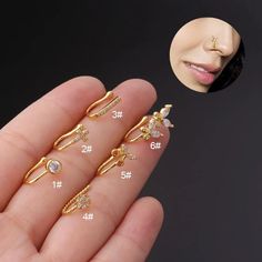 four different types of nose piercings on someone's hand with the image of a woman's face in the background