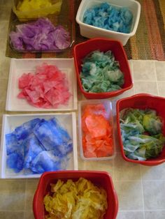 several bowls filled with different types of colored tissue paper on a counter top next to each other