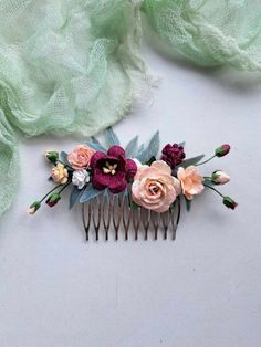 This burgundy flower hair comb wedding , of artificial flowers This a beautiful and delicate hair accessory for brides and a nice gift to the bridesmaids   On the wedding day, every bride wants to look fantastic. This flower hair piece , will be a magical addition to your look on your happiest day.  This will emphasize the ease of your image.  The comb is very conveniently attached to the hair and fits in with any hairstyle.  -Material- artificial pearl and artificial greenery  -Colors-  burgundy, rust, green, white - Unique handmade.  Wedding - is one of the most important events in the life of any girl I am happy to try to make the most beautiful decoration for you, to make you feel the most beautiful bride. You deserve the best! Orange Burgundy Wedding, Burgundy Wedding Hair, Flower Hair Comb Wedding, Floral Hair Piece, Flower Hair Piece, Floral Hair Pieces, Flower Hair Pieces, Artificial Greenery, Wedding Hair Comb