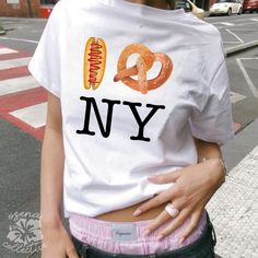 I Love New York Baby Tee  💕 ABOUT - The same baby-tee fit you know & love! - Super comfortable and soft material. - 100% sustainably sourced ring-spun cotton, coloured with OEKO-TEX certified low-impact dyes. - All t-shirts come with pearlized, tear-away labels for total comfort and a scratch-free experience. 🌟SIZING - Please find the size chart in the description before purchasing. 💖CARE/ WASH - Machine wash: warm 30C (max 40C or 105F) - Non-chlorine bleach as needed - Tumble dry: low temp ( New York Baby Tee, Aesthetic New York City, I Heart Ny, Aesthetic New York, I Love New York, 90s Design, 2000s Aesthetic, I Love Ny, Baby T Shirts