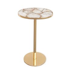 a gold and white marble side table with a round base on an isolated white background