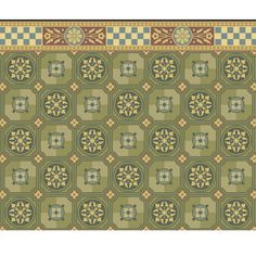 a green rug with an ornate design on the bottom, and a checkered border