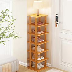 a wooden shoe rack with several pairs of shoes on it in front of a door