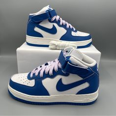 Nike Women Air Force 1 ‘07 Mid White/Sail/Doll/Military Blue Original Hoops Style? Check. Crisp Leather? Yup. Bold Details? You Got 'Em. A Set Of Colored Laces Makes This Classic Really Pop, Creating A Look That Just Can't Help But Turn Heads. Of Course, You Still Get The Era-Echoing ‘80s Construction And Air Cushioning You Love. Plush Padding Around The Mid-Cut Ankle Brings Added Comfort To This Legendary, Hard-Working Staple. Benefits Crisp, Easy-To-Clean Leather Nods To Legendary Hoops Style Air Force Blue Color, Blue And White Air Force 1, Blue Nike Air Force 1 For Streetwear, Blue High-top Nike Air Force 1 For Streetwear, Nike Court Vintage, Nike Azul, Blue Synthetic Nike Air Force 1 For Streetwear, Air Max 270 Women, Nike Airmax 270