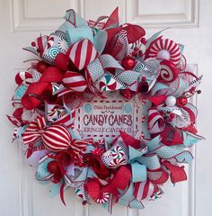 a red, white and blue wreath with candy canes on it