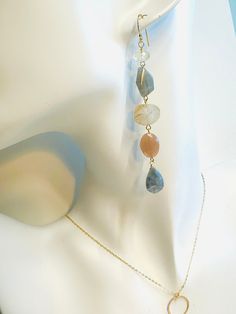 The Cha Cha earrings are a cascade of semi-precious sunstone, citrine, labradorite, peach and grey mystic moonstone, lemon and rutilated quartz. They hang approximately 3" in length. Each earring is designed with purposeful asymmetry and uniqueness. Natural gemstones may vary slightly in size and color. Handcrafted in the USA. They will arrive wrapped, perfect for gift giving! Rutilated Quartz, Gemstone Earrings, Semiprecious Stones, Citrine, Precious Stones, Moonstone, Labradorite, Semi Precious, Natural Gemstones