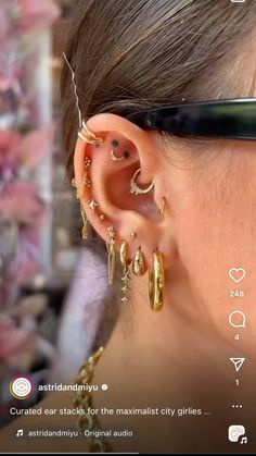 a woman wearing gold ear piercings and black glasses with the caption that reads,