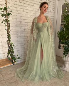 Aurora Cape Gown | Teuta Matoshi Vestidos Color Pastel, Sage Green Prom Dress, Green Wedding Dresses, Special Occasion Gowns, Cape Gown, Green Tulle, Elegant Prom Dresses, Prom Dresses Modest, Prom Dress Inspiration