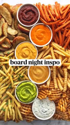 a platter filled with fries, dips and sauces next to the words board night inspo