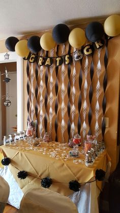 a table with balloons and decorations on it