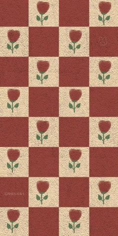 a red and white checkered pattern with flowers on it