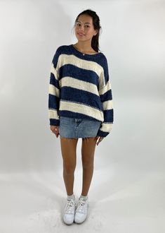 Stay cozy and chic in our Striped Oversized Cable Knit Sweater. The bold stripes add a pop of style, making it easy to pair with your favorite jeans or leggings. Whether you're lounging at home or out and about, this sweater delivers effortless comfort and a trendy look! The Details Cable Knit Striped Pattern Oversized Fit 80% Acrylic 20% Nylon [#other] Hand wash cold separately Do not wring or twist Lay flat to dry Dry clean [/other] Casual Knit Sweater With Contrast Stripes, Oversized Striped Chunky Knit Sweater, Trendy Striped Chunky Knit Sweater, Spring Striped Chunky Knit Sweater, Navy Casual Sweater With Contrast Stripes, Trendy Striped Soft Knit Sweater, White Casual Sweater With Contrast Stripes, Casual Blue Sweater With Contrast Stripes, Fall Dinner Outfit