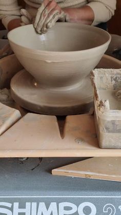 a person working on a pottery wheel