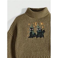 a sweater with two black cats on it