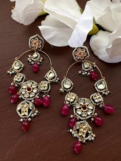 This pair of earrings has its own quirky charm. These earrings come as a perfect accessory to elevate your look from drab to delightful. One word that perfectly describes these earrings is royal. These earrings get their sophisticated look from the intricate design-work done on them. Each pattern is flawless and is the result of the meticulous attention to details craftsmen. 100% Satisfaction Guarantee: Long Lasting Plating, High-Quality Stones, Highest quality and craftsmanship. Gifting: This p Single Chandbali Earring For Festive Occasions, Festive Chandbali Single Earring, Kundan Hoop Earrings For Gift, Diamond Earrings Wedding, Earring Indian, Sabyasachi Jewelry, Pakistani Earrings, Sabyasachi Jewellery, Traditional Earrings